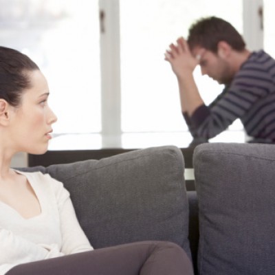 woman staring at scared man