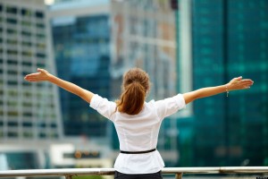 young woman with arms outstretched