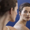 woman-looking-in-mirror