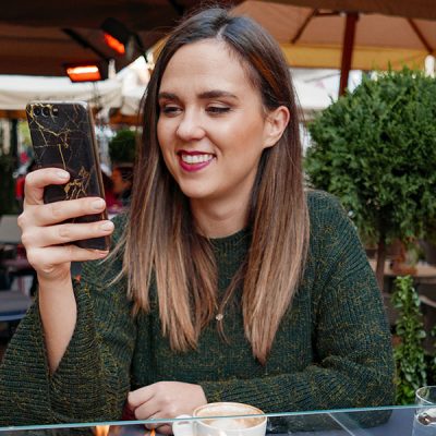 woman-smiling-at-phone